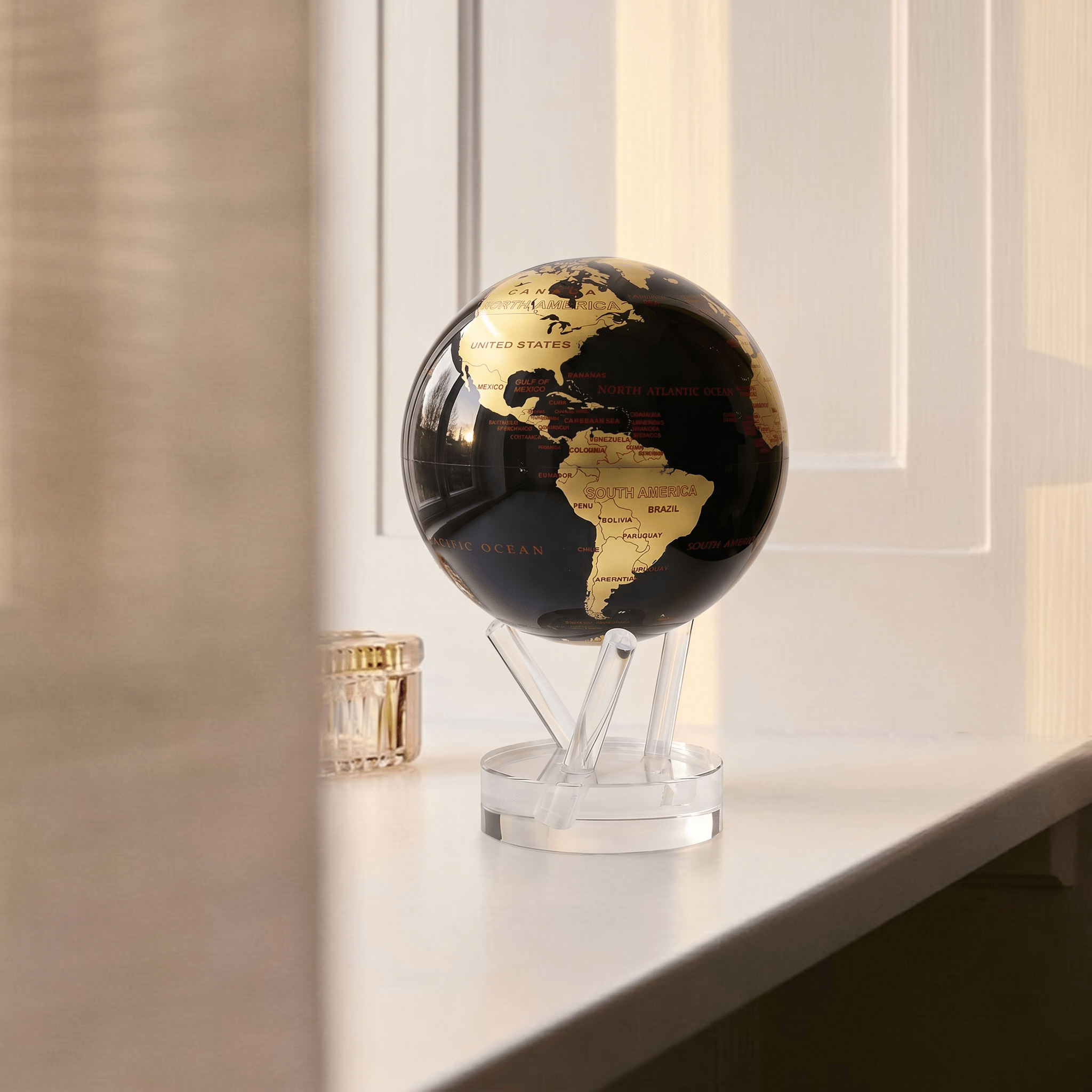 MOVA Globe displayed by a window in a modern interior