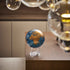 Cerulean Blue & Gold MOVA Globe on acrylic base in modern interior
