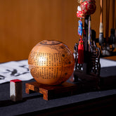 HEART SUTRA GOLD GLOBE on wooden stand, perfect meditative gift for collectors, art lovers, and feng shui inspired décor.