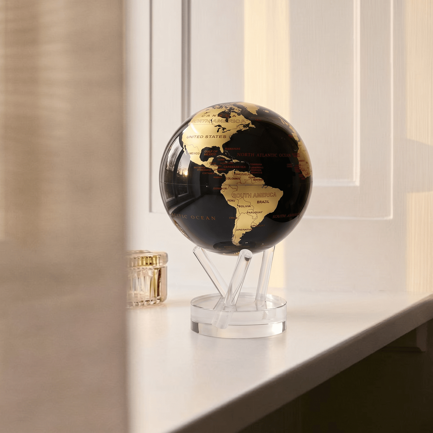 MOVA Globe displayed by a window in a modern interior