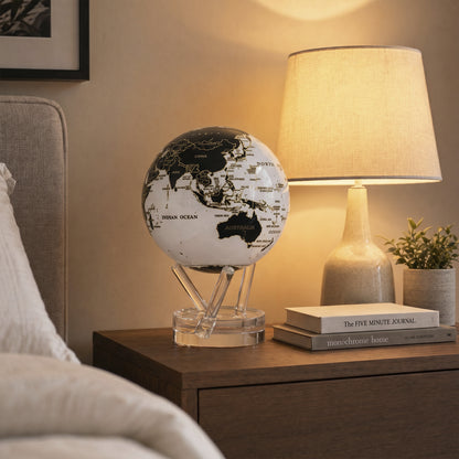 Gilded Terra Lux MOVA Globe on a modern bedside table