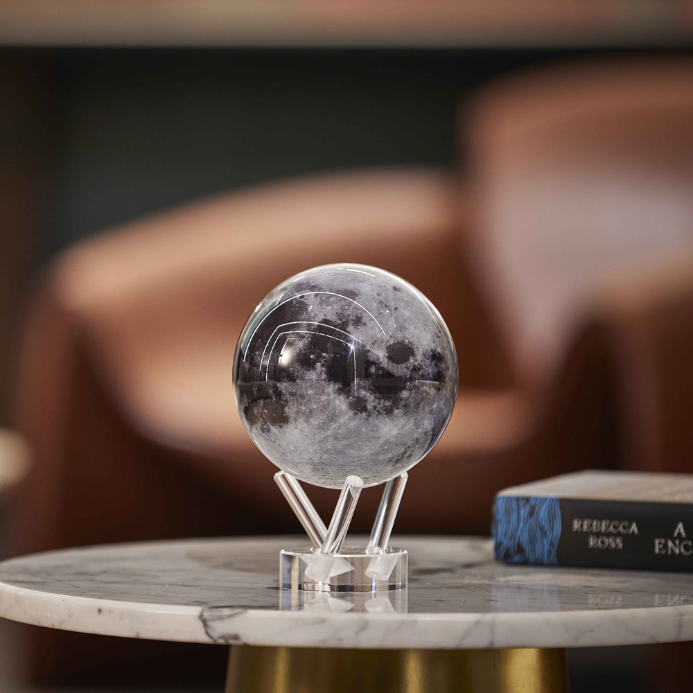 Moon MOVA Globe on marble tabletop with acrylic base