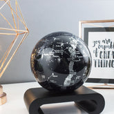CONSTELLATIONS MOVA Globe with black wood base, astronomy-inspired décor with luminous star maps and celestial design.