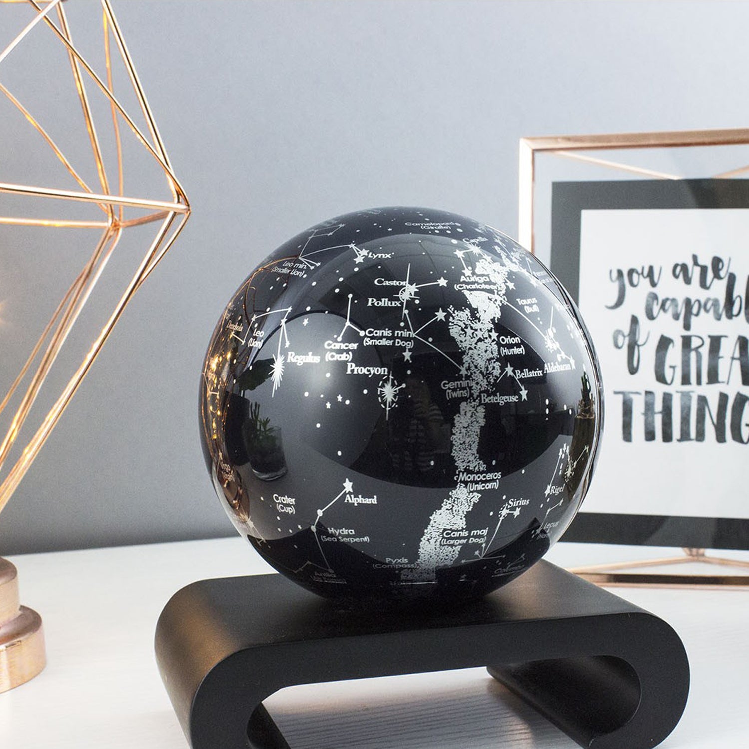 CONSTELLATIONS MOVA Globe with black wood base, astronomy-inspired décor with luminous star maps and celestial design.