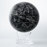 CONSTELLATIONS MOVA Globe close-up with silver star patterns, rotating sphere powered by ambient light and hidden magnets.