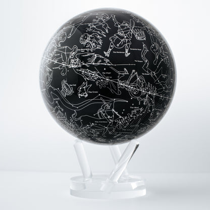 CONSTELLATIONS MOVA Globe close-up with silver star patterns, rotating sphere powered by ambient light and hidden magnets.