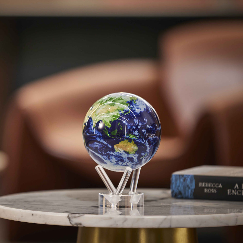MOVA Globe with realistic Earth imagery on a marble side table