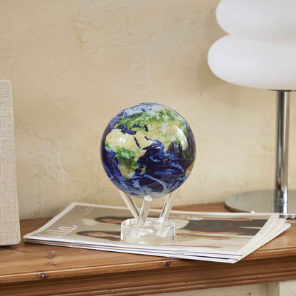 Earth with Clouds MOVA Globe styled on a wooden side table