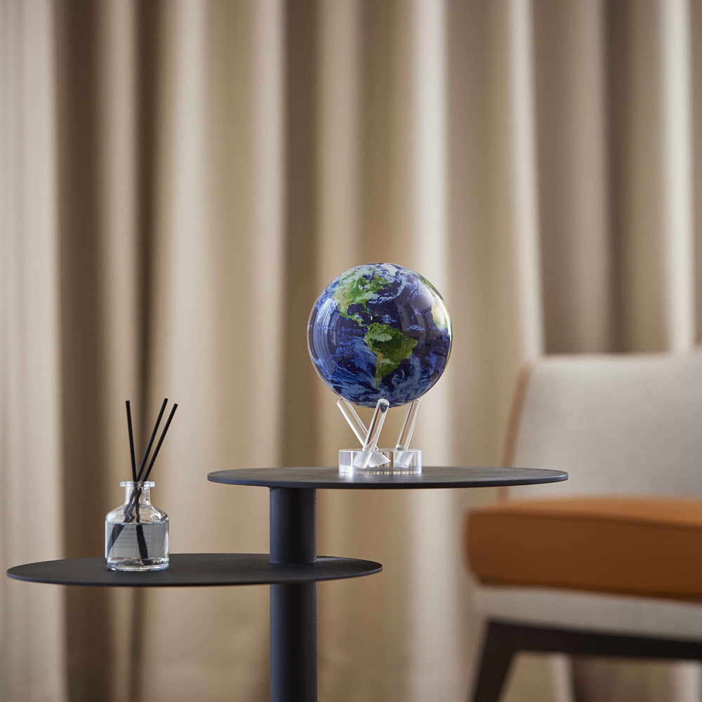 MOVA Globe displayed on a modern side table in a minimalist living room