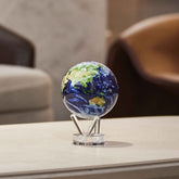 Earth MOVA Globe displayed on a minimalist white table